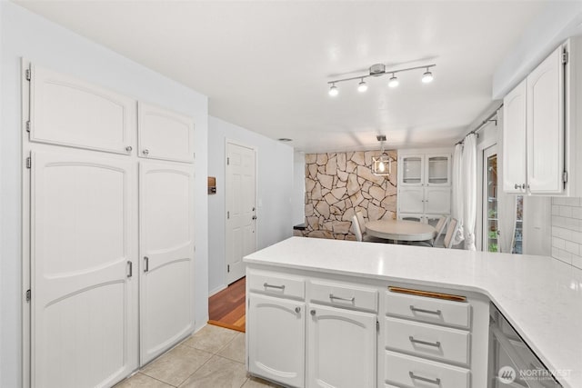 3527 Cain Rd SE, Olympia, WA 98501 - kitchen with a peninsula, white cabinets, light countertops, and light tile patterned floors