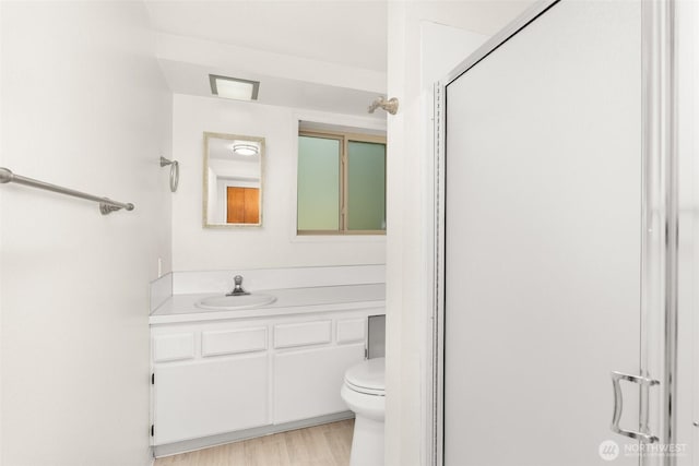 3527 Cain Rd SE, Olympia, WA 98501 - bathroom with vanity, a shower stall, and wood finished floors