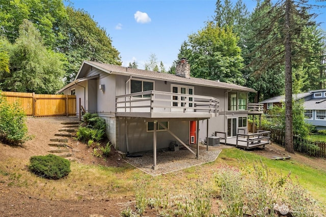 3527 Cain Rd SE, Olympia, WA 98501 - rear view of house featuring a chimney and a wooden deck