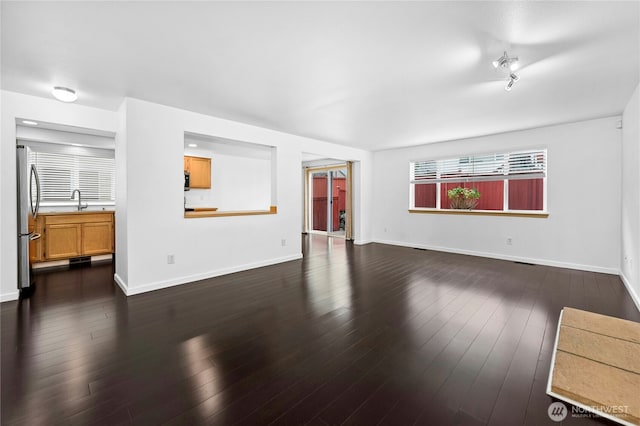 19350 113th Ave SE, Kent, WA 98031 - unfurnished living room with a sink and dark wood-style floors