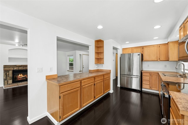 19350 113th Ave SE, Kent, WA 98031 - kitchen featuring freestanding refrigerator, dark wood-style flooring, light countertops, a fireplace, and recessed lighting