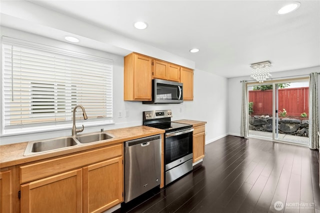 19350 113th Ave SE, Kent, WA 98031 - kitchen featuring appliances with stainless steel finishes, light countertops, dark wood finished floors, recessed lighting, and a chandelier