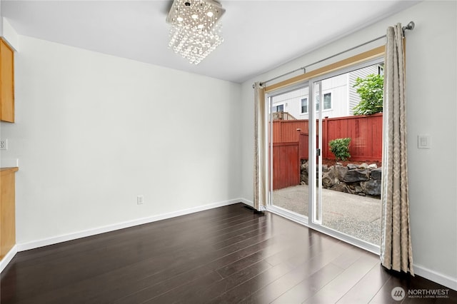 19350 113th Ave SE, Kent, WA 98031 - unfurnished dining area featuring dark wood finished floors and a chandelier