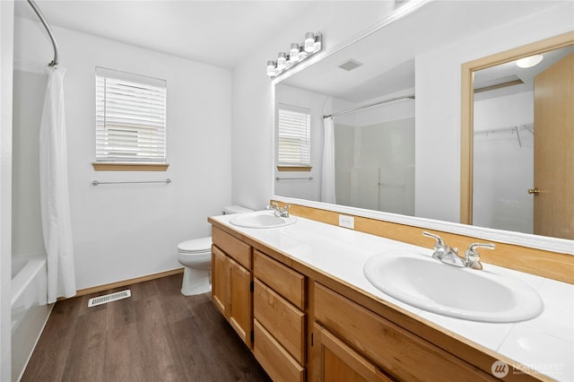 19350 113th Ave SE, Kent, WA 98031 - full bathroom featuring wood finished floors, double vanity, and shower / bathtub combination with curtain