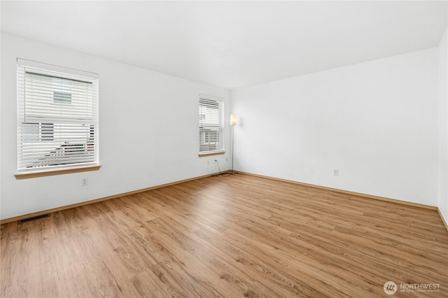 19350 113th Ave SE, Kent, WA 98031 - empty room featuring wood finished floors and baseboards