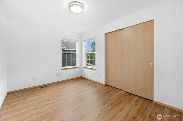 19350 113th Ave SE, Kent, WA 98031 - unfurnished bedroom with wood finished floors and a closet