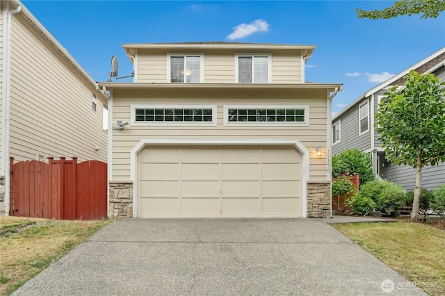 19350 113th Ave SE, Kent, WA 98031 - traditional home with stone siding, a garage, and concrete driveway