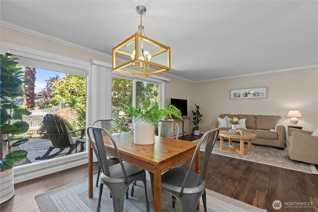 1302 N 6th St Unit 8, Tacoma, WA 98403 - dining room featuring a chandelier, crown molding, and dark wood finished floors