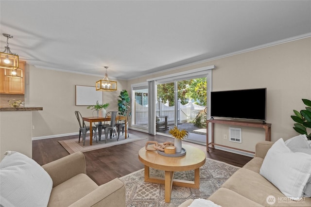 1302 N 6th St Unit 8, Tacoma, WA 98403 - living room featuring dark wood-style floors, a chandelier, and crown molding