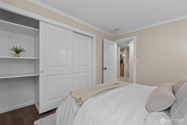 1302 N 6th St Unit 8, Tacoma, WA 98403 - bedroom featuring ornamental molding, wood finished floors, and a closet