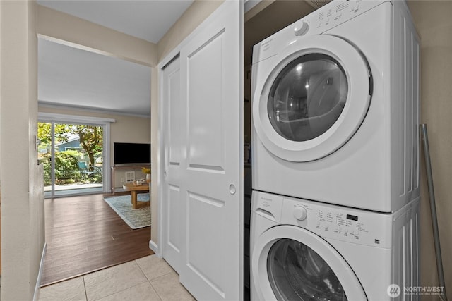 1302 N 6th St Unit 8, Tacoma, WA 98403 - laundry room with stacked washer / drying machine and light tile patterned flooring