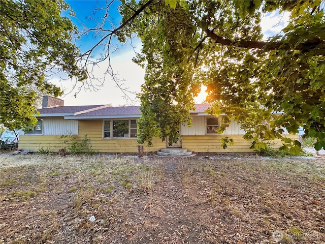 724 Hanford St, Omak, WA 98841 - view of front of house with a chimney and roof with shingles