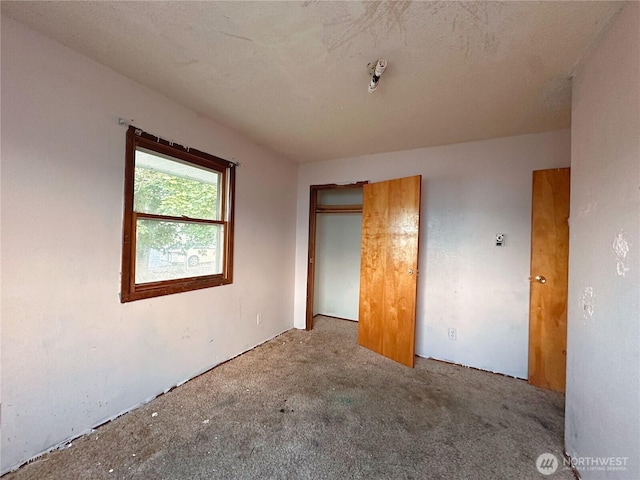 724 Hanford St, Omak, WA 98841 - unfurnished bedroom featuring carpet flooring and a closet
