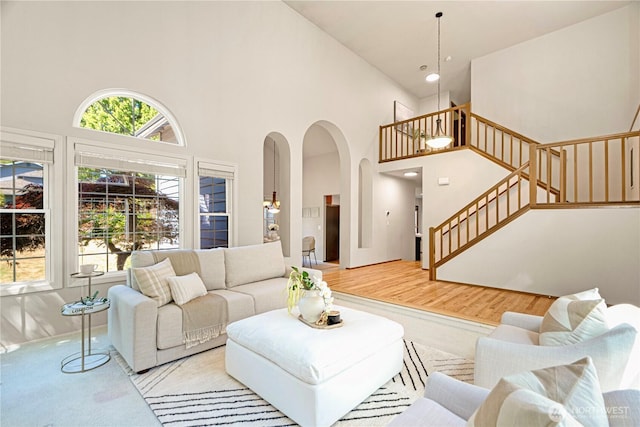 15101 91st Pl NE, Bothell, WA 98011 - living area with high vaulted ceiling, arched walkways, and stairs