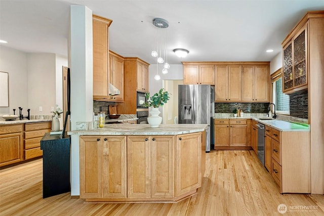 15101 91st Pl NE, Bothell, WA 98011 - kitchen with stainless steel appliances, a peninsula, light wood-style floors, decorative backsplash, and light countertops