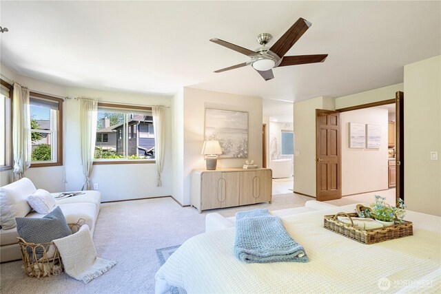 15101 91st Pl NE, Bothell, WA 98011 - bedroom with light carpet, connected bathroom, and ceiling fan
