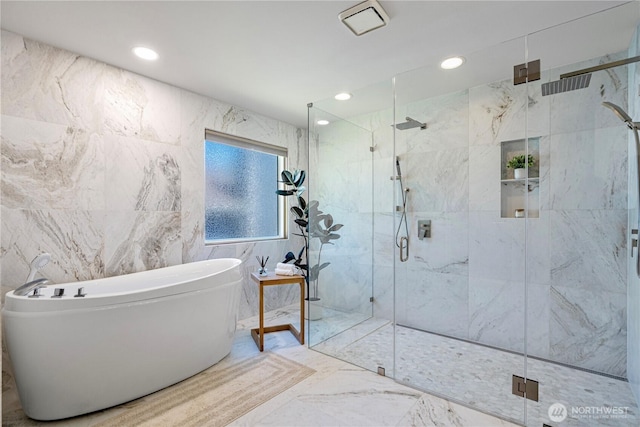 15101 91st Pl NE, Bothell, WA 98011 - full bathroom featuring a marble finish shower, marble tiled floors, a freestanding bath, recessed lighting, and tile walls