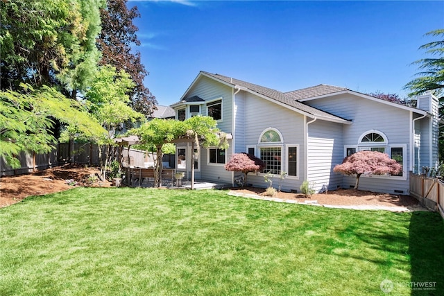 15101 91st Pl NE, Bothell, WA 98011 - rear view of property featuring a fenced backyard, a patio area, and roof with shingles