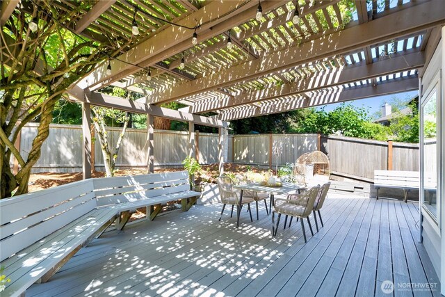 15101 91st Pl NE, Bothell, WA 98011 - wooden terrace featuring outdoor dining area, a fenced backyard, and a pergola