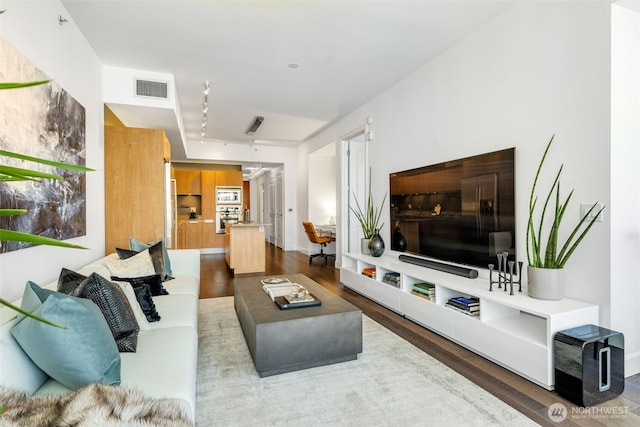 1920 4th Ave Unit 1207, Seattle, WA 98101 - living room with wood finished floors