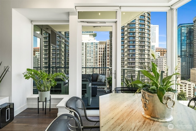 1920 4th Ave Unit 1207, Seattle, WA 98101 - dining room featuring a city view, a wall of windows, and wood finished floors