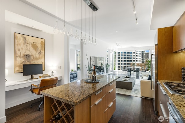 1920 4th Ave Unit 1207, Seattle, WA 98101 - kitchen featuring modern cabinets, stainless steel gas stovetop, dark wood-style floors, and brown cabinets