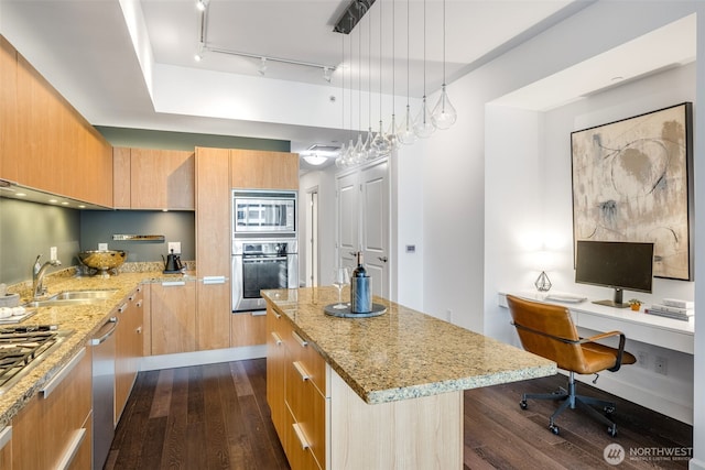 1920 4th Ave Unit 1207, Seattle, WA 98101 - kitchen featuring stainless steel appliances, dark wood finished floors, modern cabinets, and light stone countertops