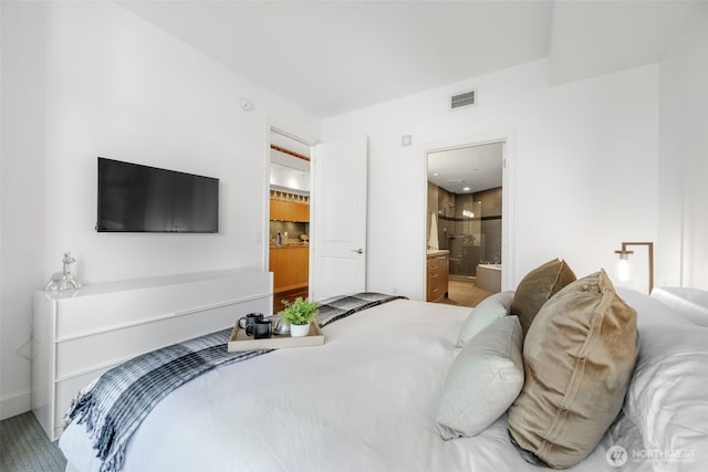 1920 4th Ave Unit 1207, Seattle, WA 98101 - bedroom with connected bathroom