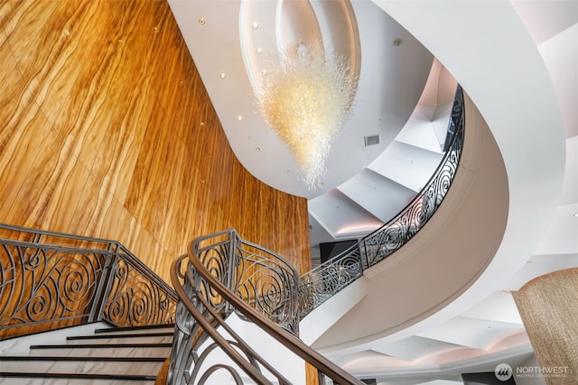1920 4th Ave Unit 1207, Seattle, WA 98101 - staircase featuring a high ceiling and wooden walls