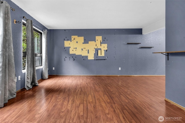 9404 Stone Ave N, Seattle, WA 98103 - unfurnished living room featuring wood finished floors and baseboards