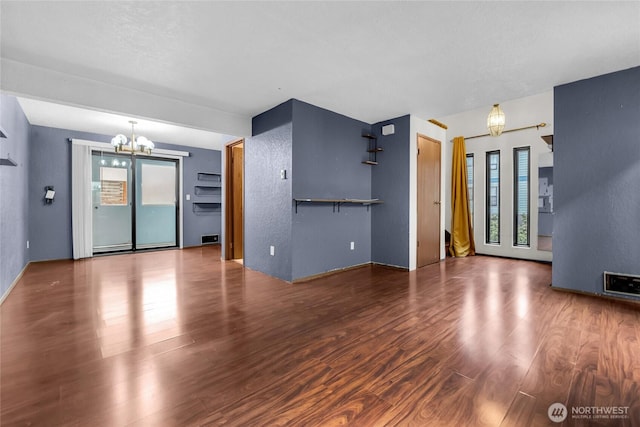 9404 Stone Ave N, Seattle, WA 98103 - unfurnished living room with a chandelier and wood finished floors