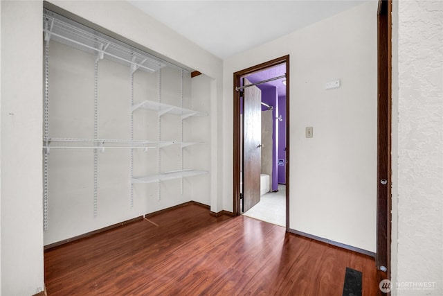 9404 Stone Ave N, Seattle, WA 98103 - spacious closet with wood finished floors