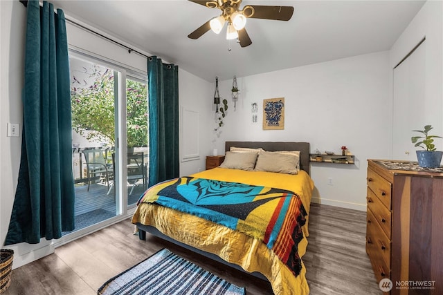 1949 S Sheridan Ave, Tacoma, WA 98405 - bedroom featuring access to exterior, wood finished floors, and ceiling fan