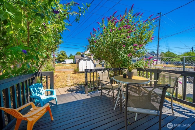 1949 S Sheridan Ave, Tacoma, WA 98405 - wooden terrace with a storage unit and outdoor dining space