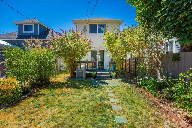1949 S Sheridan Ave, Tacoma, WA 98405 - view of front of home with a fenced backyard and a wooden deck
