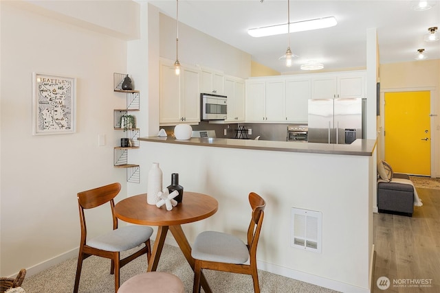 530 4th Ave W Unit 405, Seattle, WA 98119 - dining area with baseboards
