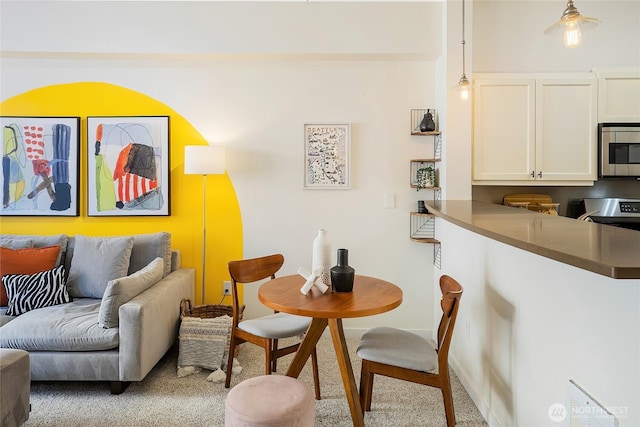 530 4th Ave W Unit 405, Seattle, WA 98119 - carpeted dining room featuring baseboards