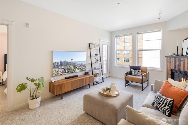 530 4th Ave W Unit 405, Seattle, WA 98119 - living room featuring carpet and a glass covered fireplace