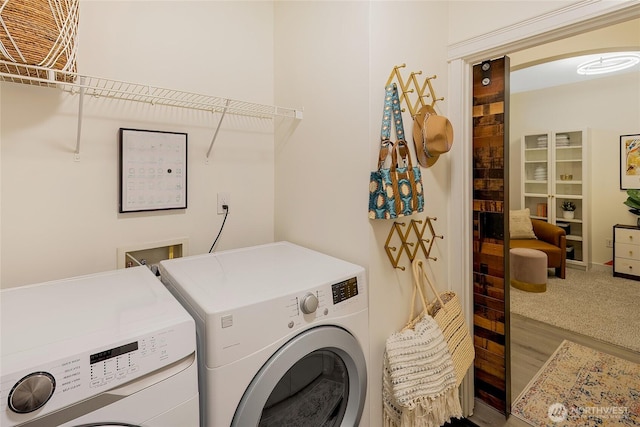 530 4th Ave W Unit 405, Seattle, WA 98119 - laundry area with independent washer and dryer and carpet