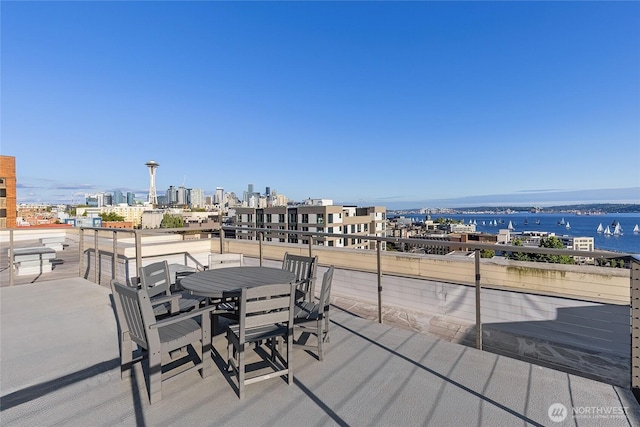 530 4th Ave W Unit 405, Seattle, WA 98119 - wooden terrace with a city view and outdoor dining space