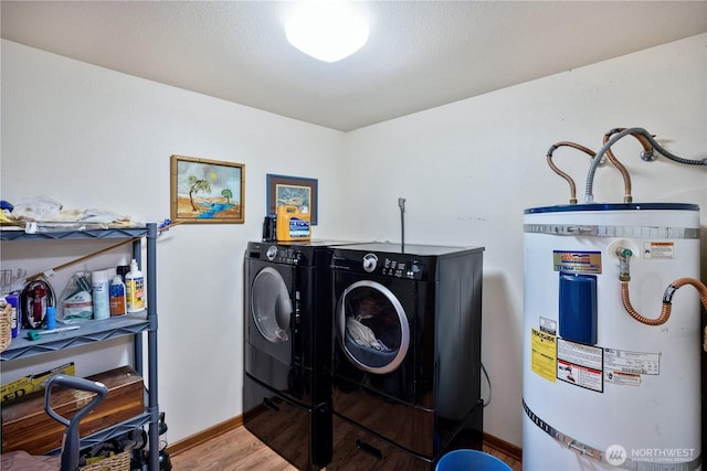 140 Admiralty Ln Unit 370, Port Ludlow, WA 98365 - laundry room with secured water heater, wood finished floors, and independent washer and dryer