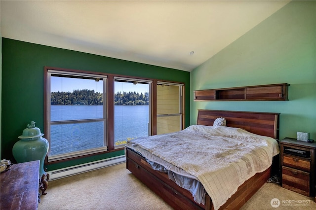 140 Admiralty Ln Unit 370, Port Ludlow, WA 98365 - bedroom with a baseboard radiator, light colored carpet, vaulted ceiling, and a water view