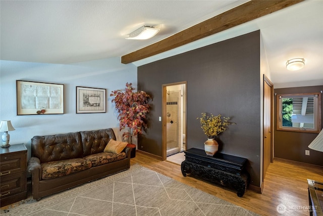 140 Admiralty Ln Unit 370, Port Ludlow, WA 98365 - living room featuring wood finished floors and beam ceiling