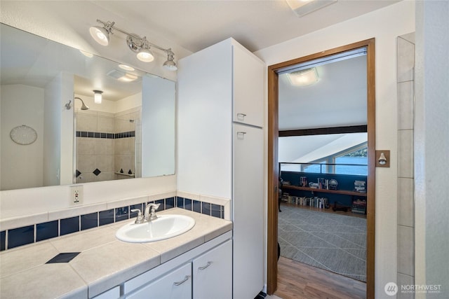 140 Admiralty Ln Unit 370, Port Ludlow, WA 98365 - bathroom with vanity, wood finished floors, and a tile shower