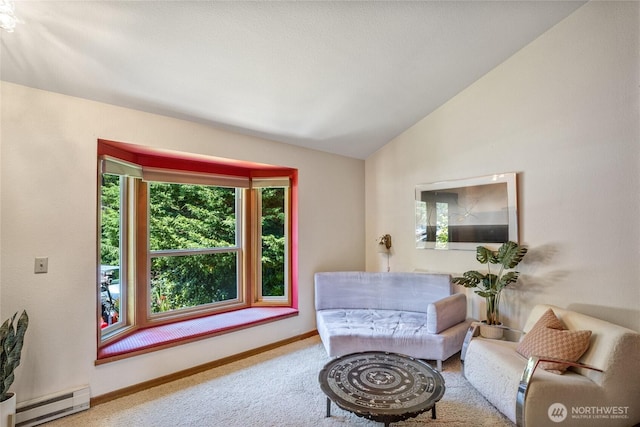 140 Admiralty Ln Unit 370, Port Ludlow, WA 98365 - sitting room featuring a baseboard heating unit, lofted ceiling, and carpet