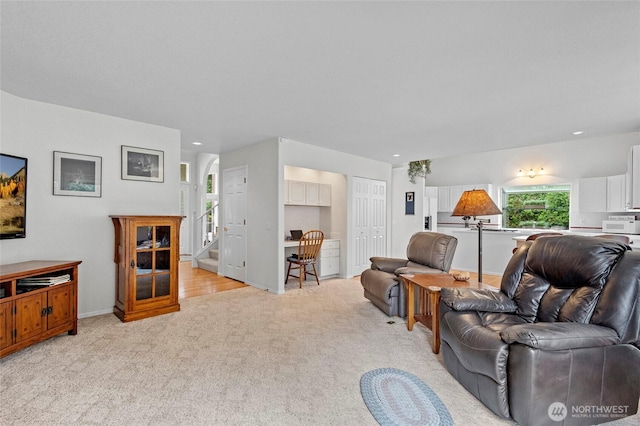 4015 E Broadway St, Mount Vernon, WA 98274 - living area with light carpet, stairway, arched walkways, and recessed lighting