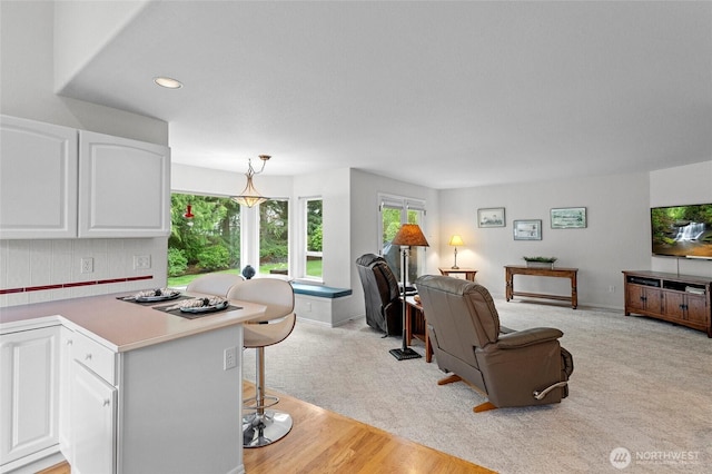 4015 E Broadway St, Mount Vernon, WA 98274 - living room with recessed lighting, a desk, light wood finished floors, and light colored carpet