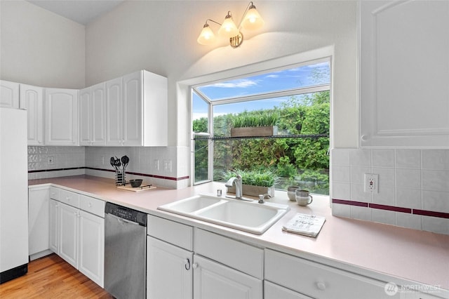 4015 E Broadway St, Mount Vernon, WA 98274 - kitchen featuring dishwasher, freestanding refrigerator, white cabinetry, and light countertops