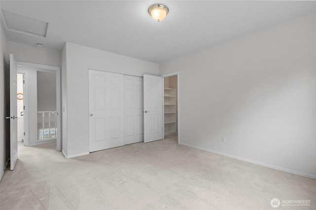 4015 E Broadway St, Mount Vernon, WA 98274 - unfurnished bedroom featuring light carpet, a closet, and attic access
