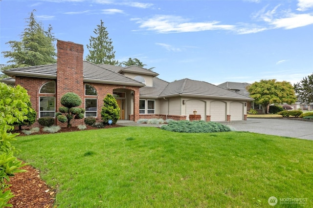 4015 E Broadway St, Mount Vernon, WA 98274 - view of front of property with a garage, driveway, a tile roof, and a front yard
